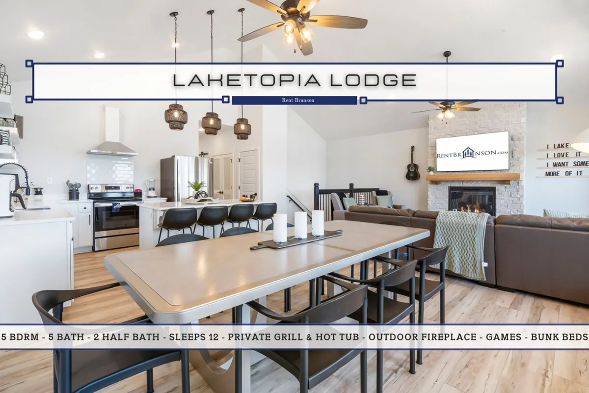 This image showcases a cohesive open-concept living space with a dining table, kitchen island, fireplace, living area seating, and a television—all flooded with natural light from large windows. The room feels spacious yet inviting, ideal for gatherings and shared activities.